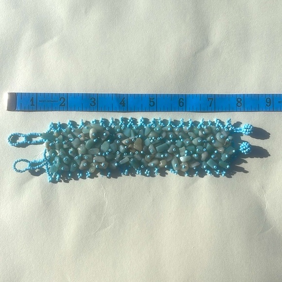 Cute bracelet! Aqua colored stones in a light blue elasticized & beaded band. - Picture 6 of 6
